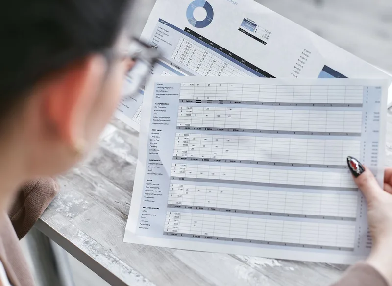 Analyst reviewing a spreadsheet checklist to verify order data before calculating AOV