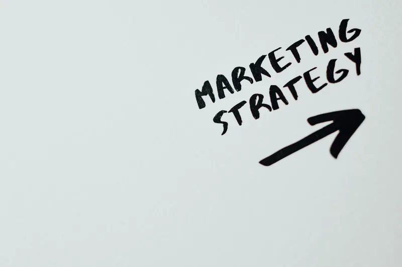 Handwritten marketing strategy notes with an arrow, representing the planning behind a converting landing page template