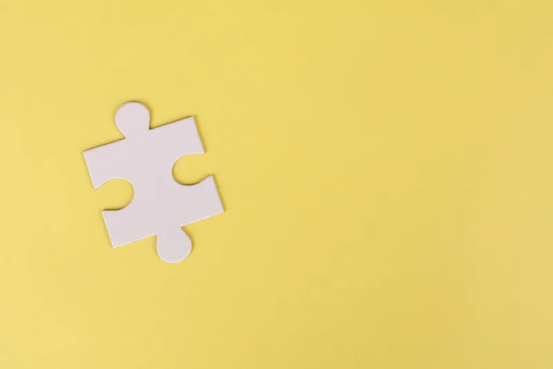 Puzzle piece against a plain background, representing how template sections need to fit your specific offer to convert